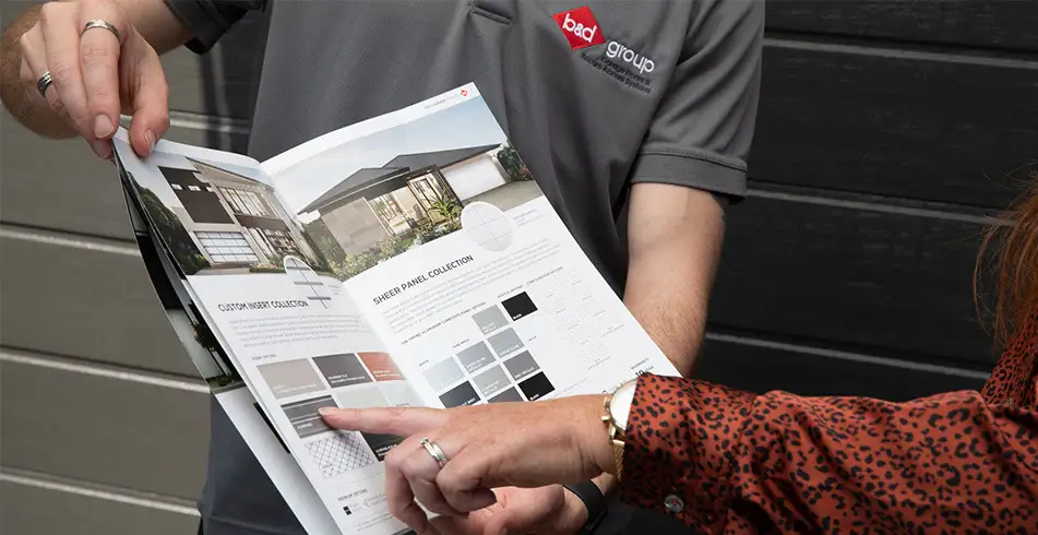 Original as Can B&D Customer Looking at Brochures