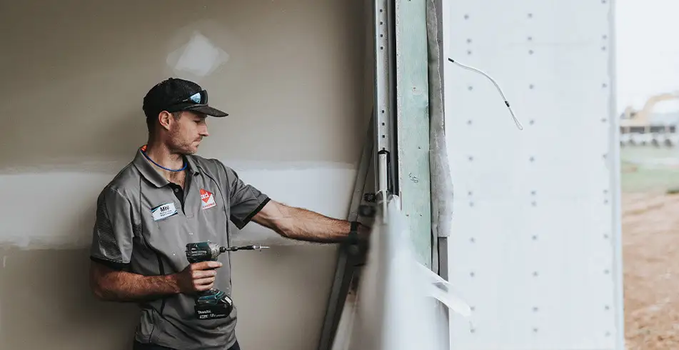 Technician Installing Garage Door