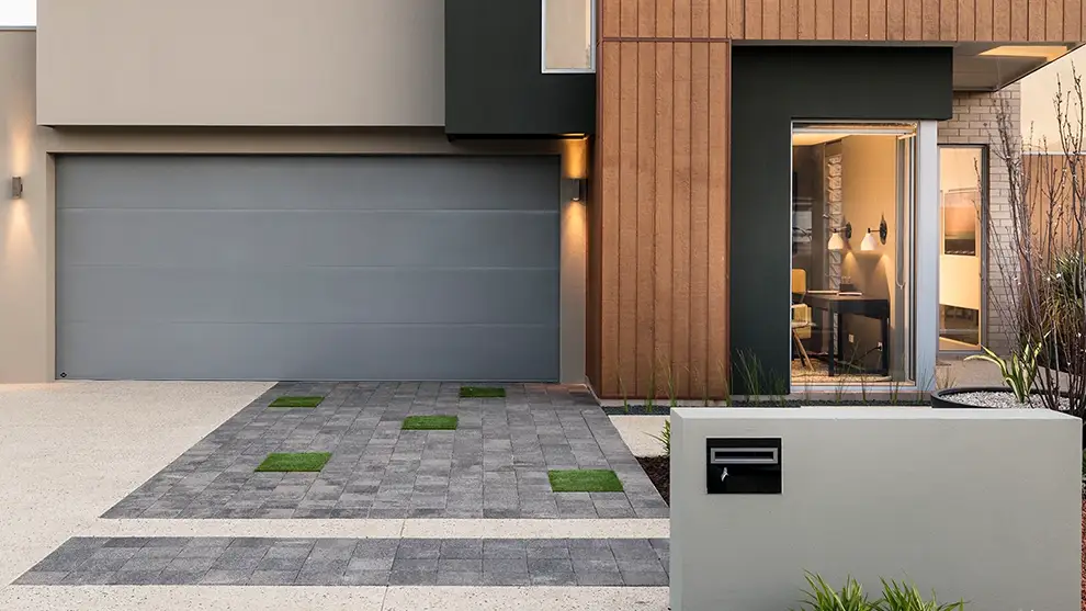 Original as Can B&D Front View of House and Garage with a Sectional Garage Door Installed