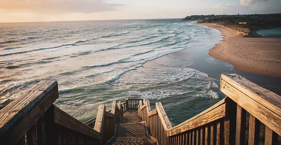 Wooden steps leading down towards a beach