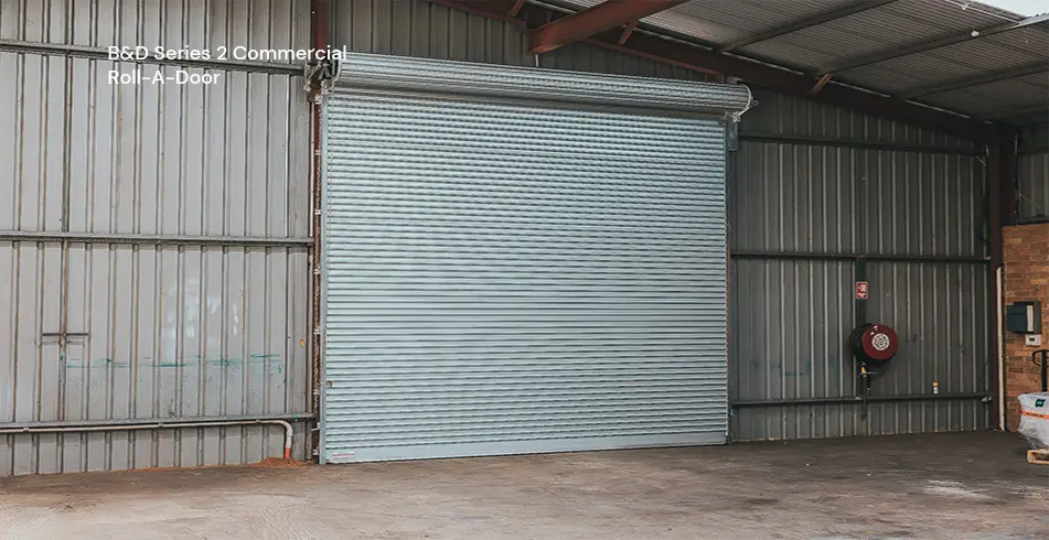Safe as Can B&D Angled view of Series 2 commercial Roll-A-Door installed in warehouse